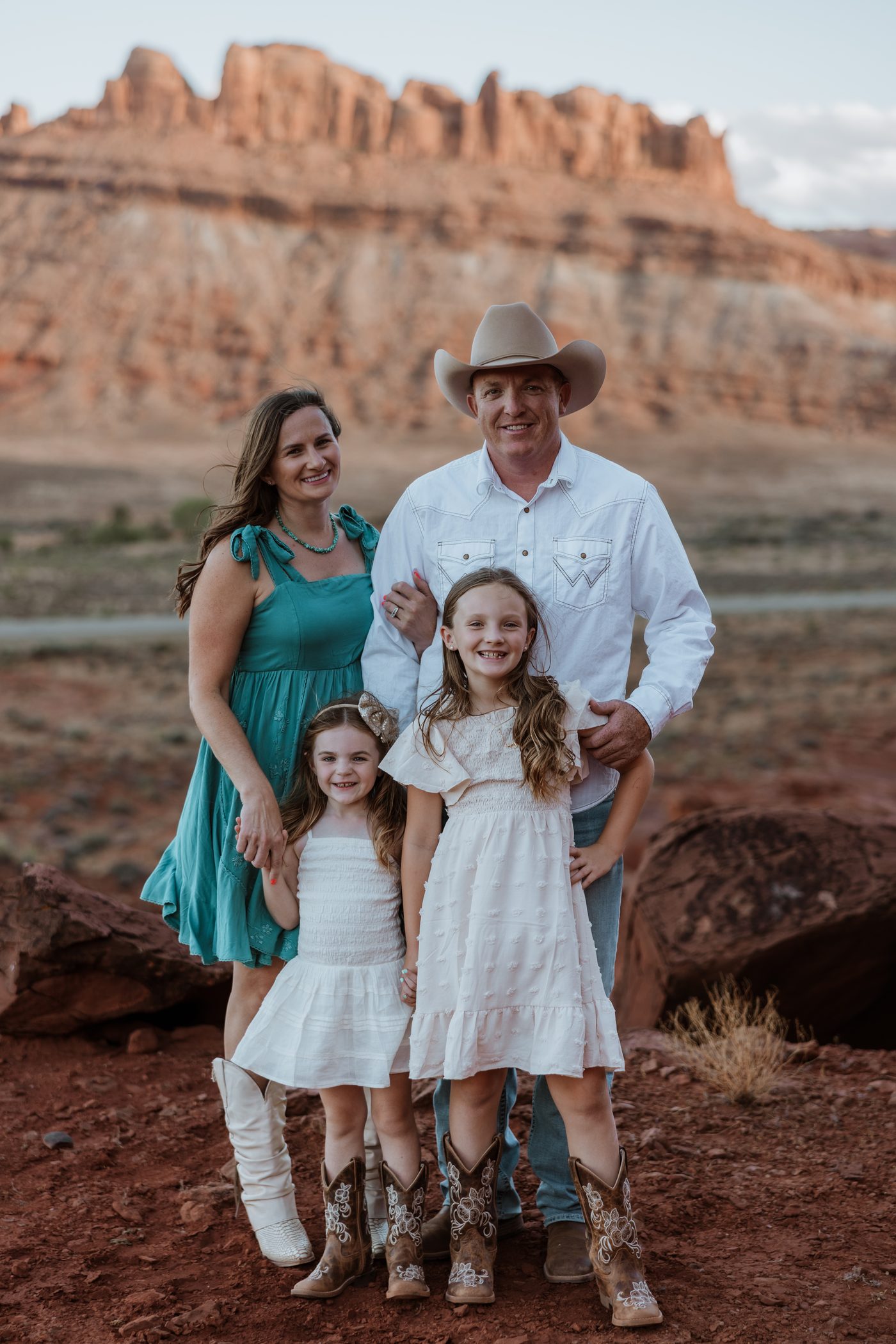 Jamison Wiggins with his wife Amy and their two daughters in the red rock country of Grand County, Utah